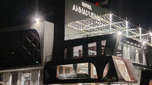 A hotel sign with the name "Hotel Annapuram" and decorative lights. - Hotel Annapurna (Ratlam)