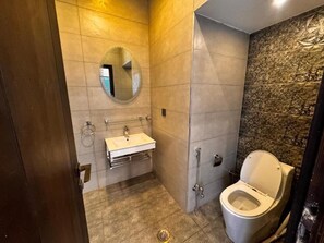 Shower, free toiletries, slippers, towels