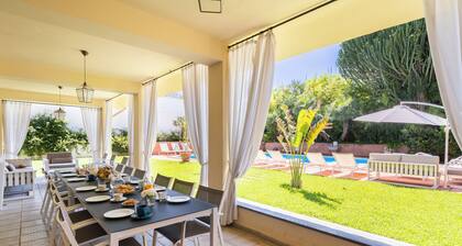 Villa surrounded by greenery with private pool, ideal for families and friends
