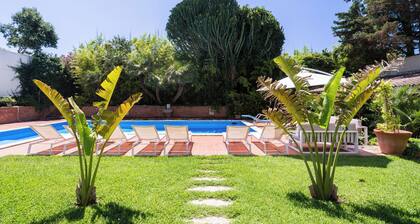 Villa surrounded by greenery with private pool, ideal for families and friends