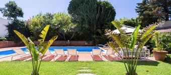 Villa surrounded by greenery with private pool, ideal for families and friends