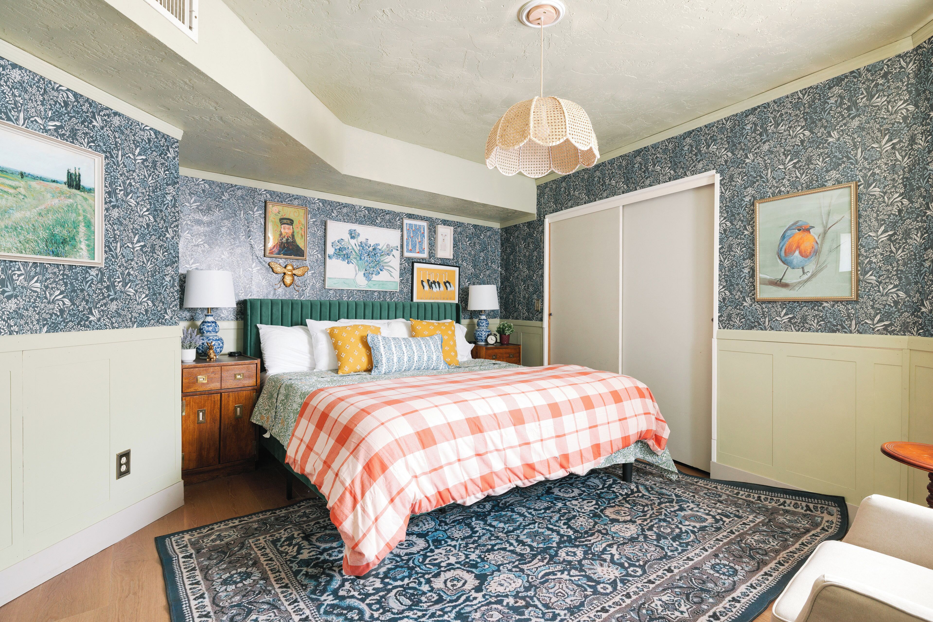 A bedroom with a bed, a nightstand, a dresser, and a chair.