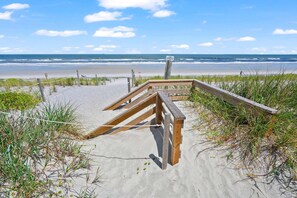 A wooden boardwalk leading to a sandy beach with ocean views. - Welcome Basket Pool By Beach Fire Pit BBQ PS4 (St. Augustine)