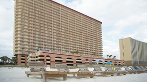 A high-rise hotel with multiple balconies and a beachside location. - Master on Gulf & close to Everything & Free round of Golf & Activities Daily! (Panama City Beach)