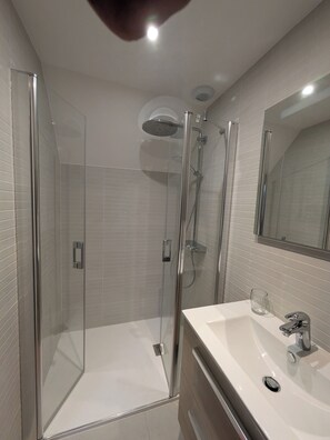 Shower, hair dryer, towels, toilet paper