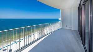 A balcony with a clear view of the beach and ocean. - Phoenix Gulf Shores Ii 2003 3 Bedroom Condo (Gulf Shores)