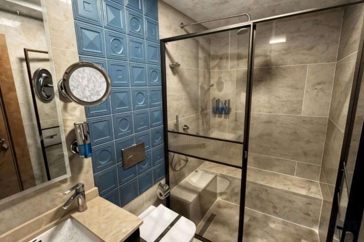Bathroom | Shower, hair dryer, slippers, towels