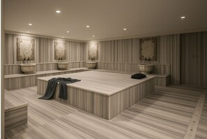 A modern bathroom with a large central island, two sinks, and decorative wall panels.