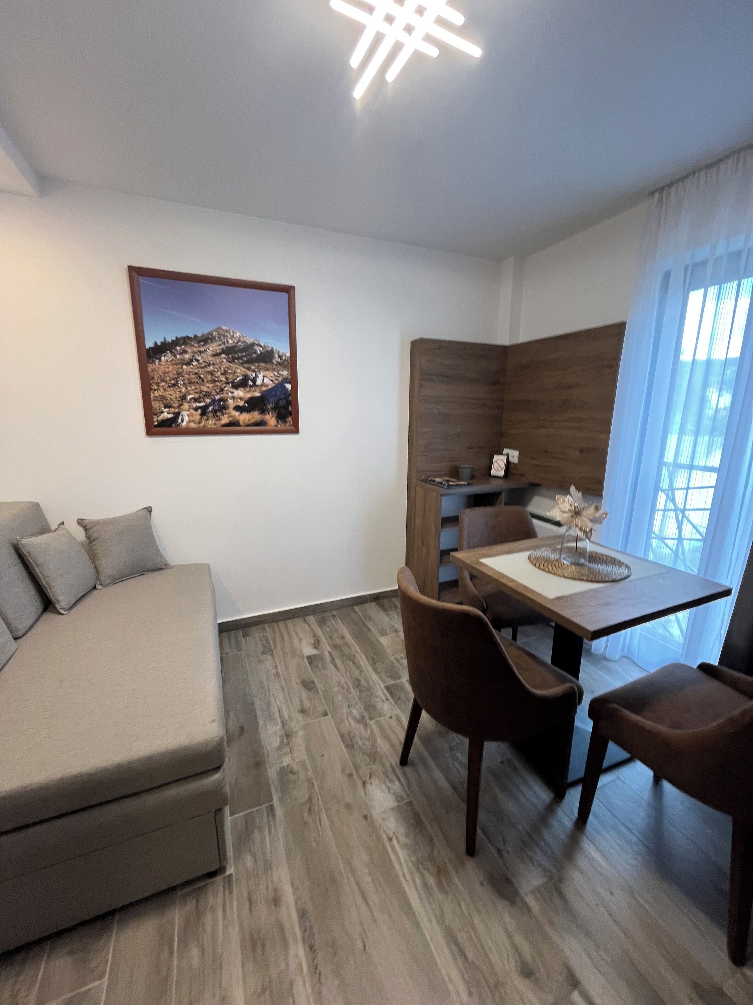 Family Apartment | Minibar, in-room safe, laptop workspace, blackout drapes