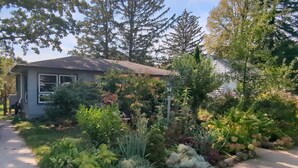A residential house with a garden in front.