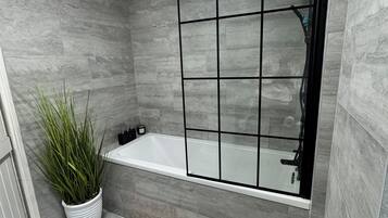 Hair dryer, towels, shampoo, toilet paper