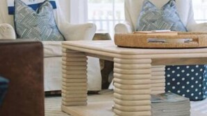 A cozy living room with a wooden coffee table, a sofa, and a patterned rug. - Large Common Areas, Quiet Street, Golf Cart Available! (Carolina Beach)
