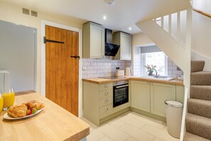 Fridge, oven, cookware/dishes/utensils