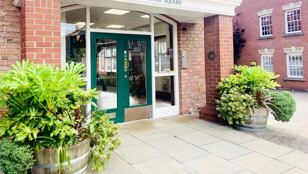 A building entrance with a sign reading "1 SILVESTER SQUARE". - The Hop Store, HU1. Experience city living in a converted brewery. (Kingston upon Hull)