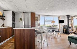 Fridge, stovetop, dishwasher, coffee/tea maker