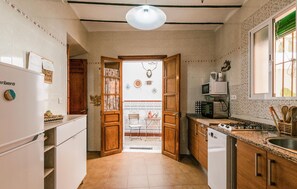 Fridge, stovetop, dishwasher, coffee/tea maker