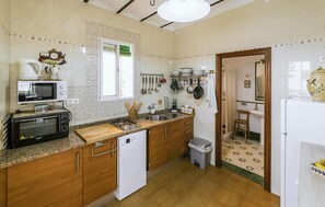 Fridge, stovetop, dishwasher, coffee/tea maker