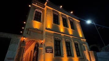 A two-story building with a sign reading 'Ekoton Cave House No.5' at the entrance.