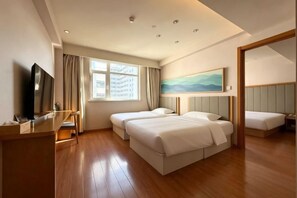 A hotel room with a large bed, a desk, a television, and a painting on the wall. - Meihao EZZI Hotel (Tianjin Youyi Road Wudadao) (Tianjin)