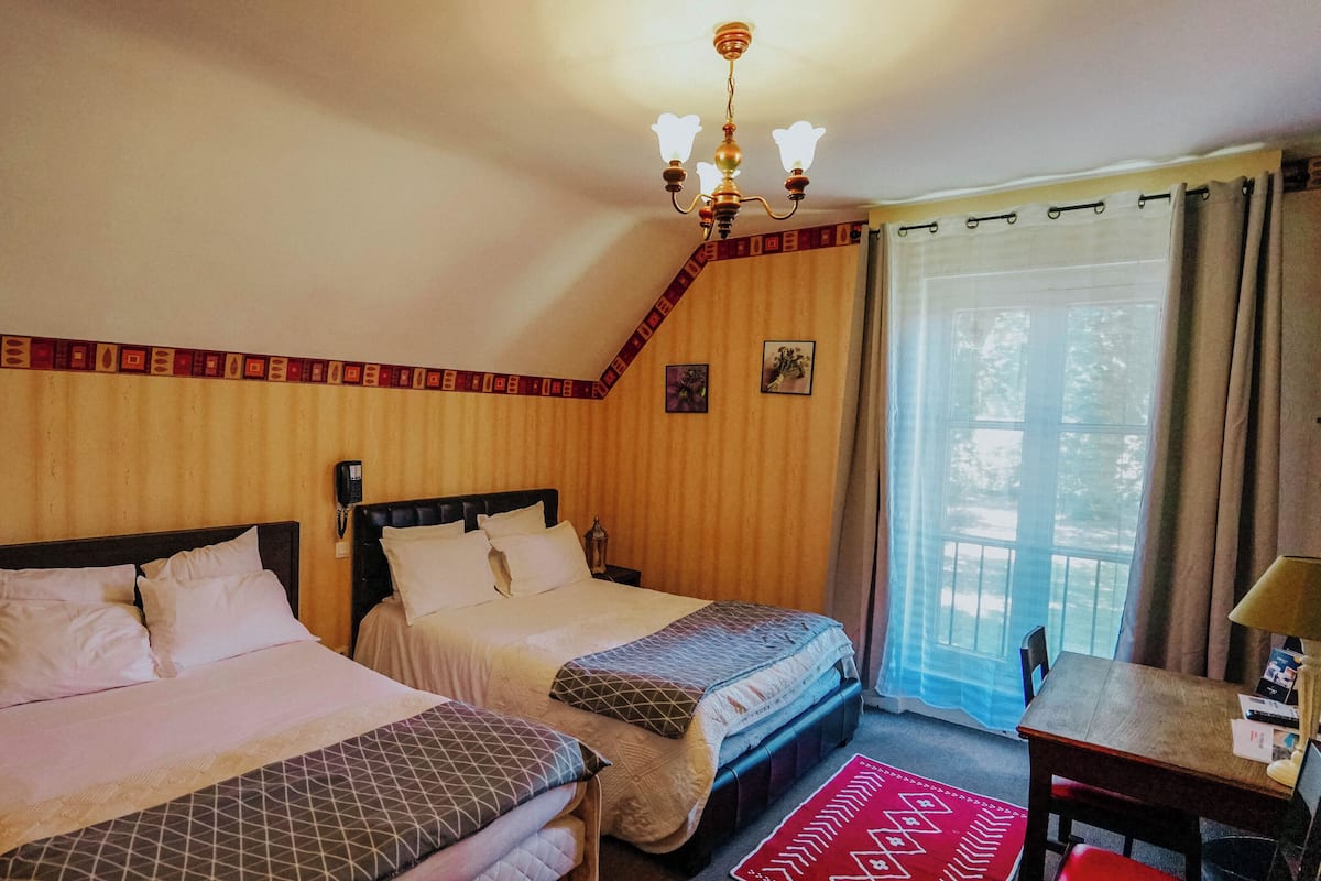 Comfort Quadruple Room, Garden View | 1 bedroom, blackout drapes, soundproofing, iron/ironing board