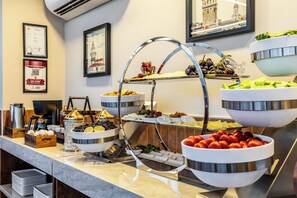 A buffet setup with various food items and a coffee station. - Emilion Hotel (Istanbul)