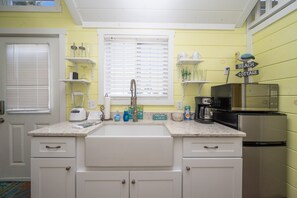 Fridge, microwave, stovetop, coffee/tea maker