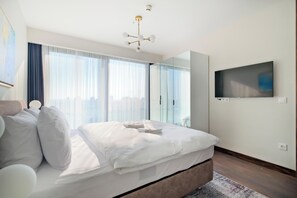Apartamento familiar | Caja fuerte, cortinas opacas, tabla de planchar con plancha