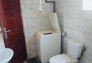 Bidet, towels, soap, toilet paper