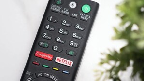 Un control remoto con botones para Google Play y Netflix.