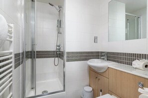Shower, hair dryer, towels, soap