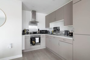 Fridge, microwave, oven, stovetop - Stylish 2-Bed Apartment | Parking | Great Location (Bletchley)