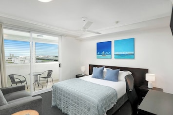 Kick back and watch TV in the bedroom, or make your way out to the undercover patio with views across the city.