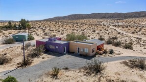 A desert landscape with three small buildings. - Private compound, offering three separate living spaces! multi families,groups (Desert Hot Springs)