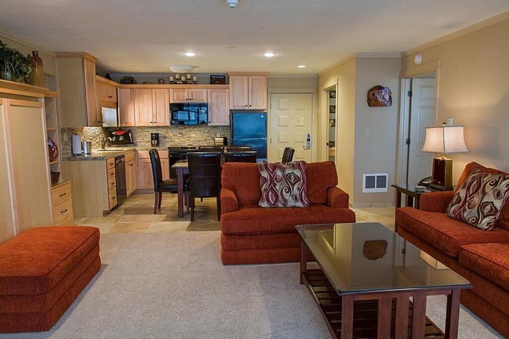 A compact living space with a kitchen, dining area, and seating area.