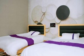 A hotel room with two beds, a modern wall design, and a small bedside table. - Colorful Art Hotel Shanghai (Shanghai)