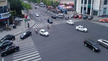 A busy urban intersection with multiple lanes and vehicles.