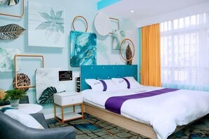 A modern hotel room with a bed, bedside tables, a desk, and a chair. - Colorful Art Hotel Shanghai (Shanghai)