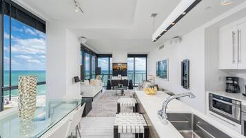 Luxury Suite, 3 Bedrooms, Kitchen, Ocean View | Living area | 55-inch flat-screen TV with cable channels