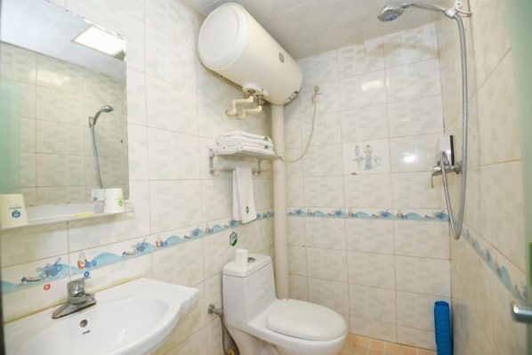 A bathroom with a sink, toilet, shower, and a towel rack. - Tianci Liangyuan Hotel (Beijing Tongzhou Fuheyuan) (Beijing)