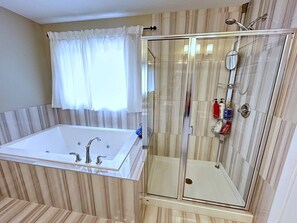 Shower, hair dryer, towels, shampoo