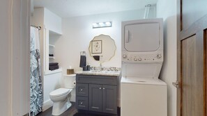 Shower, hair dryer, towels, shampoo