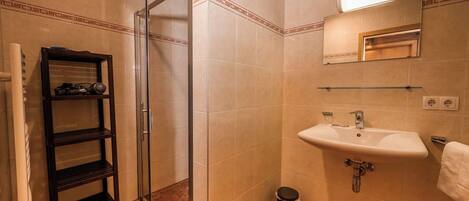 Shower, hair dryer, towels, toilet paper