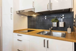 Fridge, microwave, stovetop, coffee/tea maker