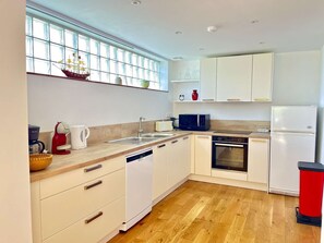 Fridge, microwave, toaster, cookware/dishes/utensils