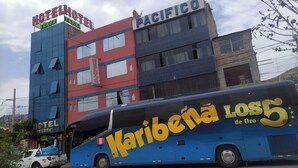 A multi-story building with signs for 'Hotel Terra' and 'Pacifico'. - HOTEL TERRA (Ayacucho)