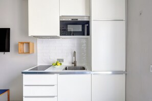 Fridge, microwave, stovetop, coffee/tea maker