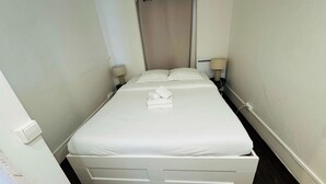 1 bedroom, desk, iron/ironing board, travel crib