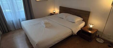 1 bedroom, desk, iron/ironing board, travel crib