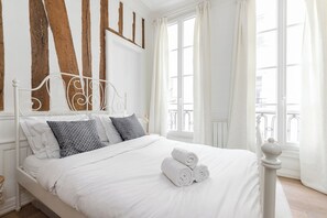 1 bedroom, desk, iron/ironing board, travel crib