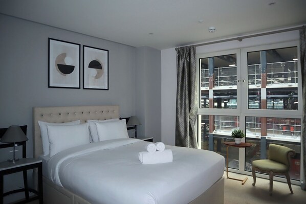 1 bedroom, desk, iron/ironing board, travel crib